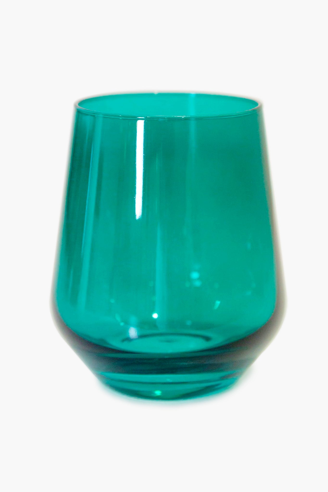 The Estelle Colored Glass tumbler features a teal hand-blown glass design with a wide base and smooth, curved sides—an elegant addition to any luxury glassware collection.