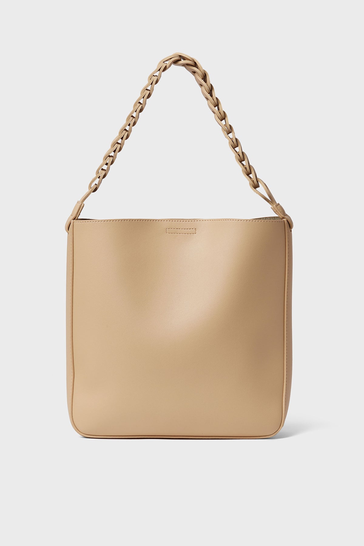 The Moda Luxe beige vegan leather handbag features a wide, braided shoulder strap—ideal for anyone seeking a trendy, stylish accessory.