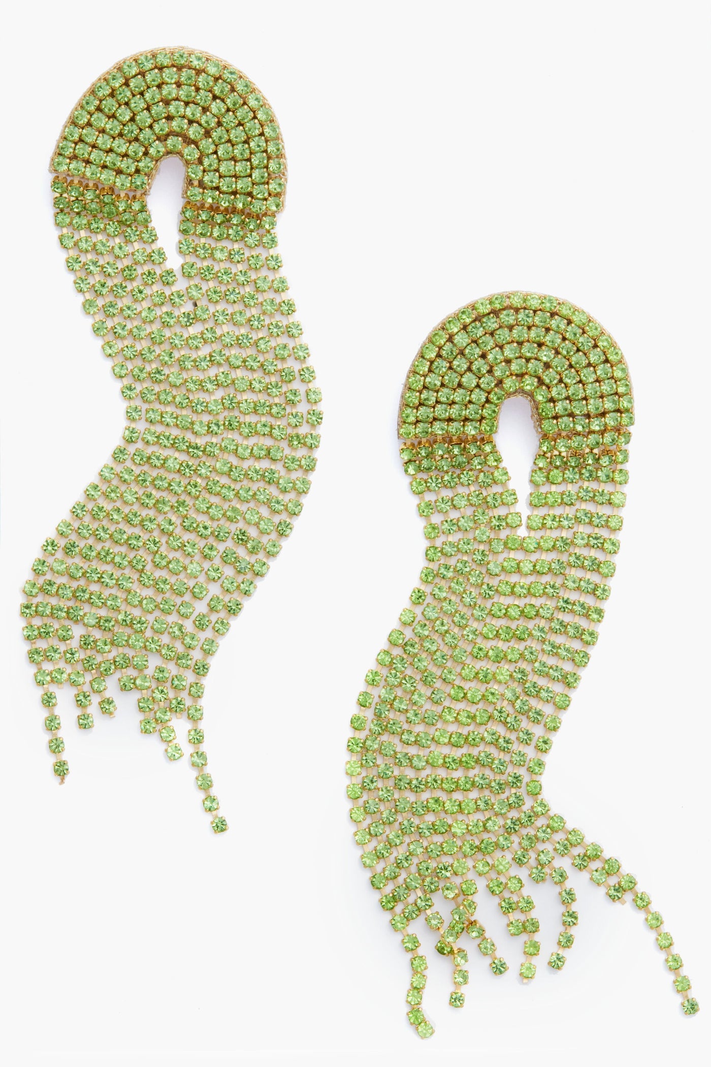 A pair of long, gold and green rhinestone Deepa Gurnani Warren earrings with a curved top and cascading wavy strands, inspired by Indian hand embroidery.