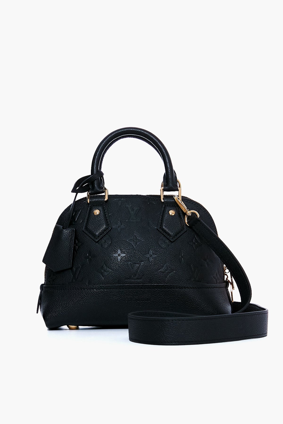 A black Tuckernuck Archive Collection Monogram Empreinte leather handbag features gold hardware, an embossed pattern, top handles, and a detachable shoulder strap.