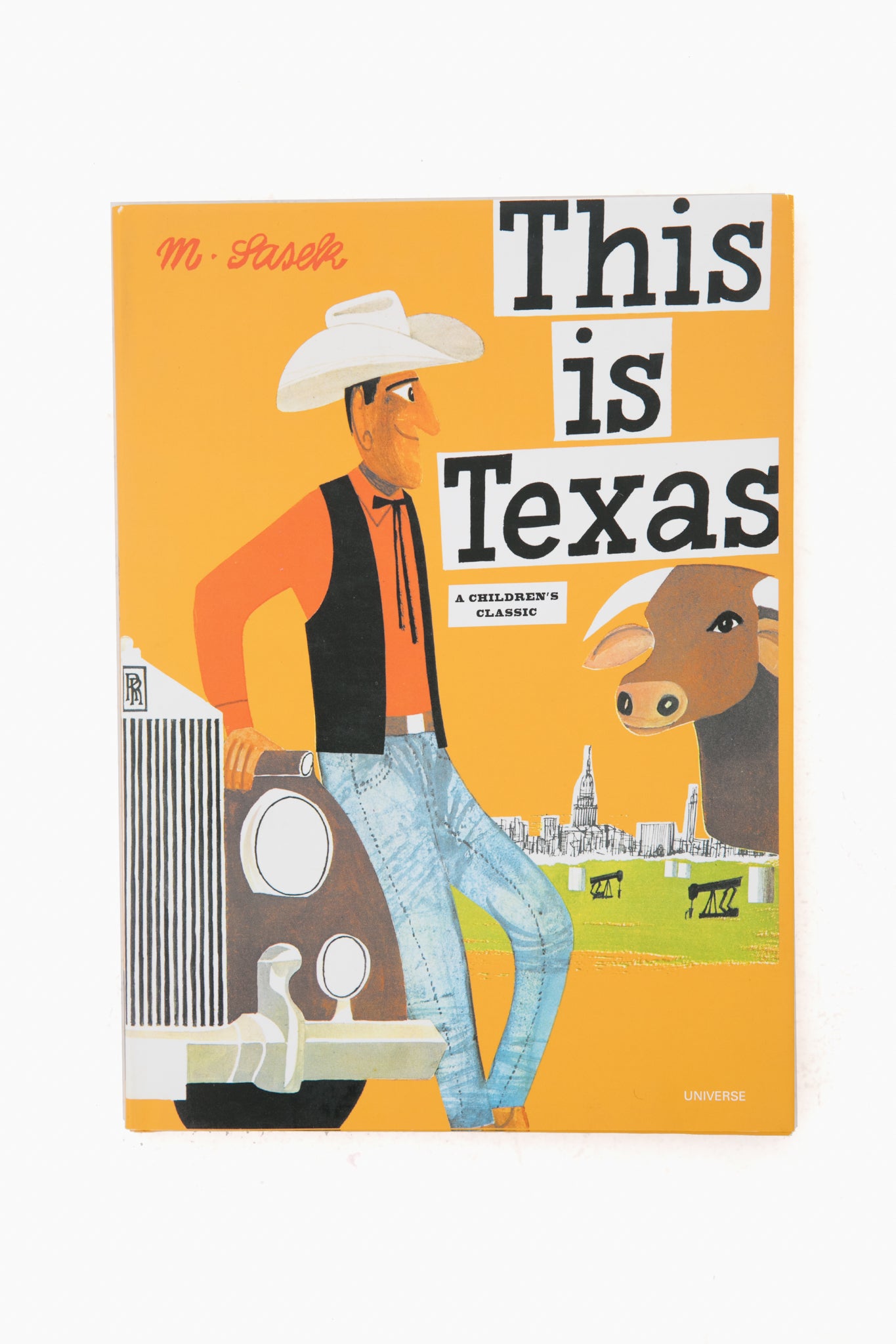 The Rizzoli children’s book cover “This is Texas” by M. Sasek shows a cowboy leaning on a car and a cow, evoking the spirit of this classic kid’s travel book.