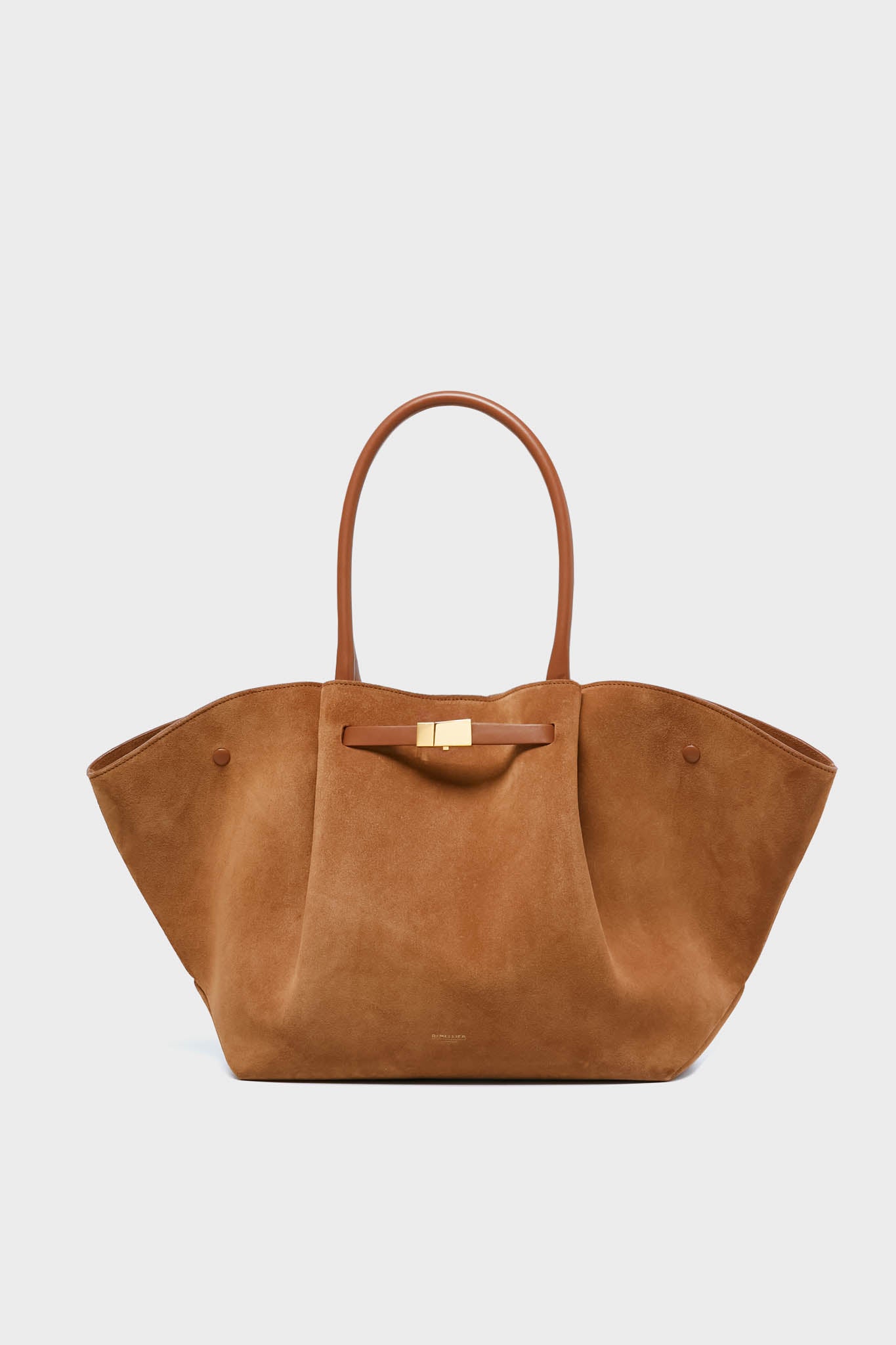 A large brown suede tote bag by Demellier, featuring structured sides, rounded leather handles, and a gold clasp—an elegant addition to any luxury womens accessories collection.
