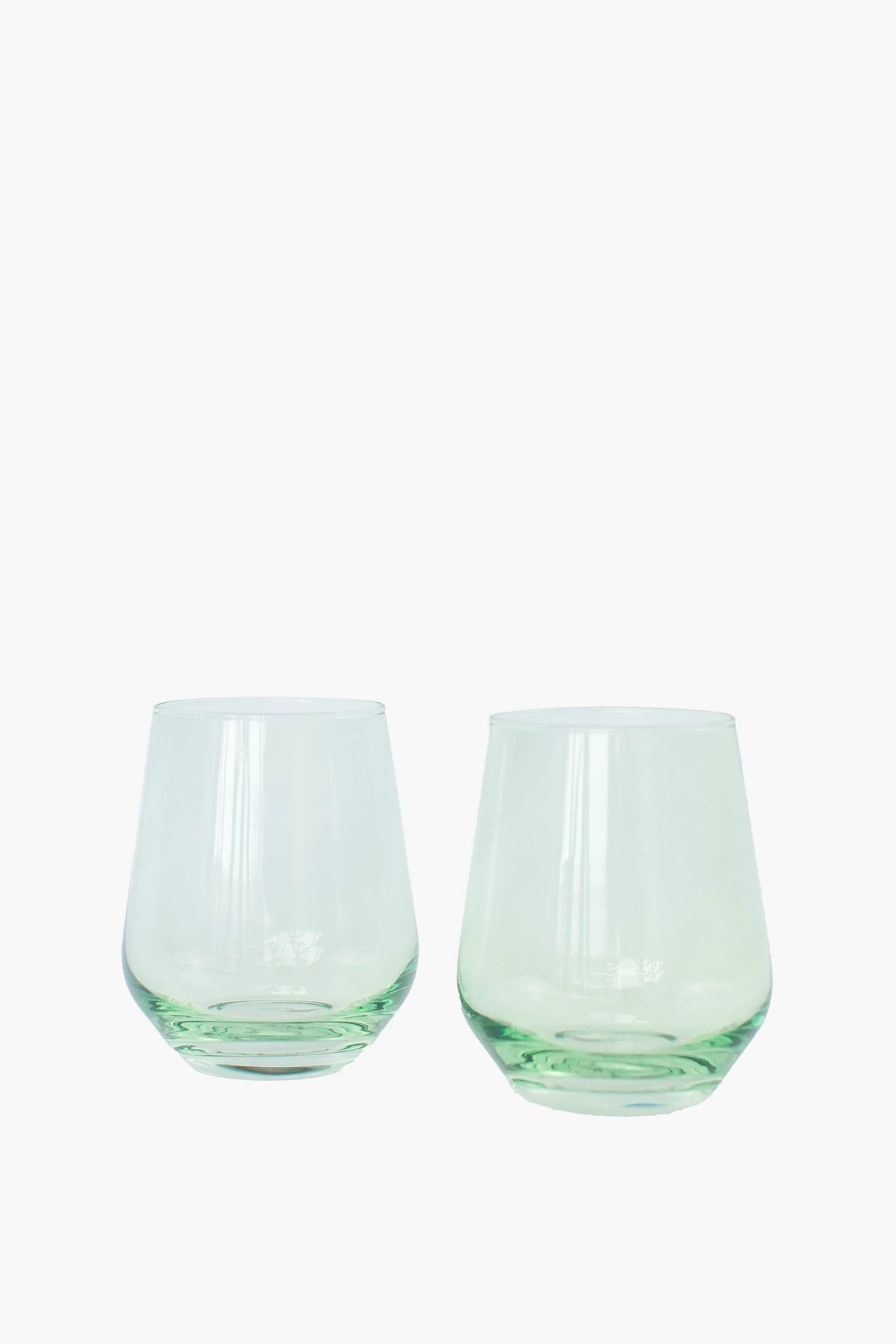 Mint Stemless Wine Glasses Set of 6, featuring classic, hand-blown, light-green tinted design for an effortless, high-end touch to any fun gathering. Perfect for elegant entertaining.