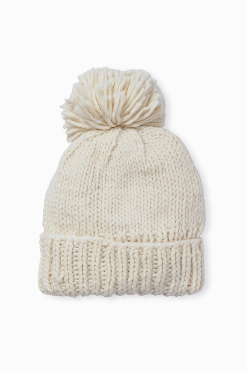 The Look by M hand-knit beanie features a soft cream color, a large pom-pom on top, and a cozy textured design.