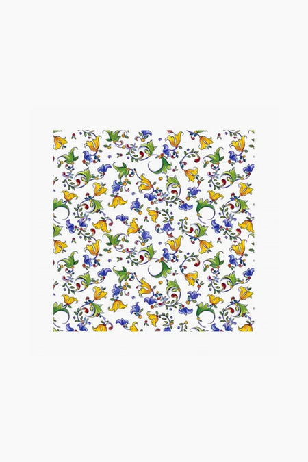 A square Le Cadeaux tablecloth featuring yellow and blue floral designs with green leaves, perfect for Italian table decor and stylish waterproof protection.
