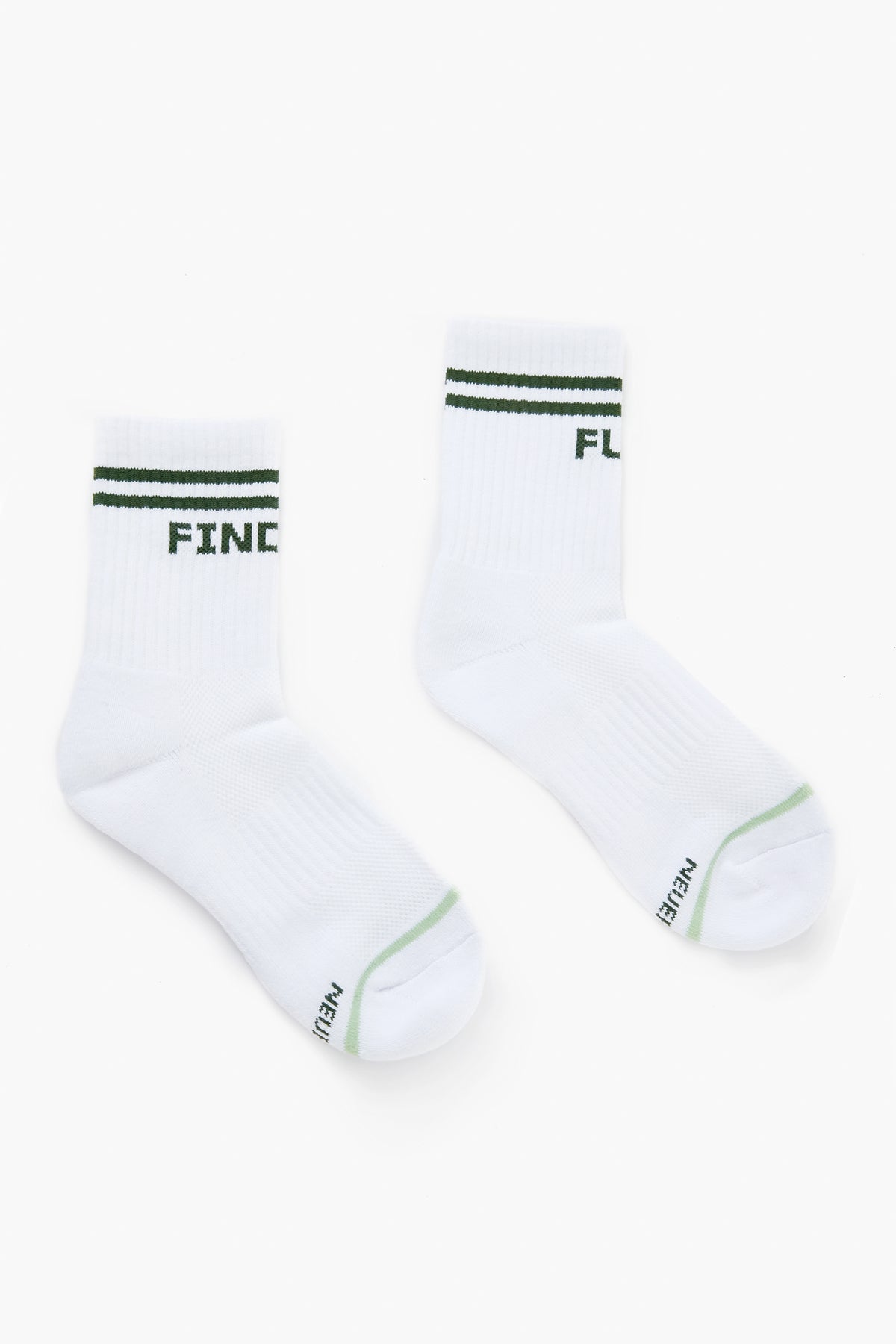 A pair of Tnuck Sport white crew-length socks with green stripes and text, laid flat.